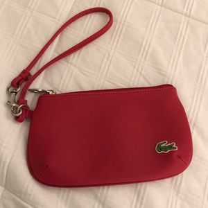 Red Lacoste wristlet
